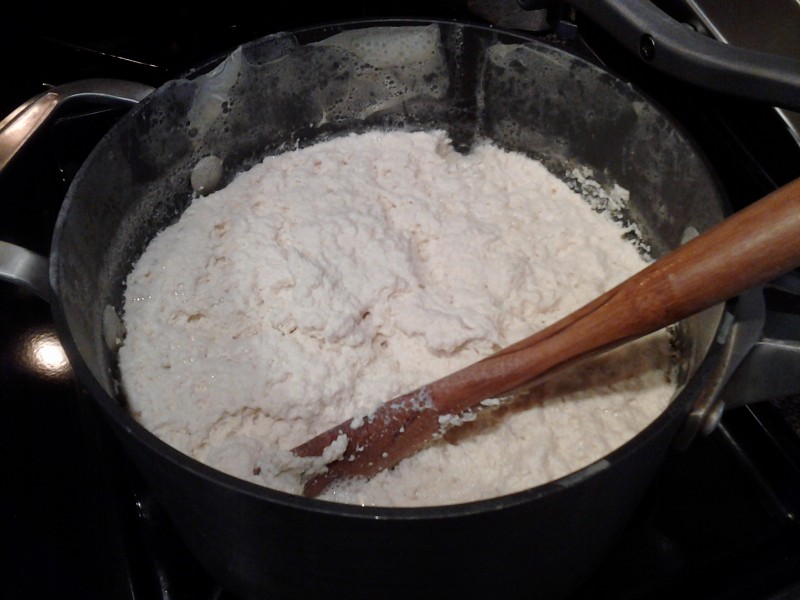 Curds form as vinegar is added