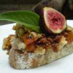 Vegan Crostini Topped with White Beans, Spicy Chorizo, Fresh Figs, Green Olives, and Marconi Almonds